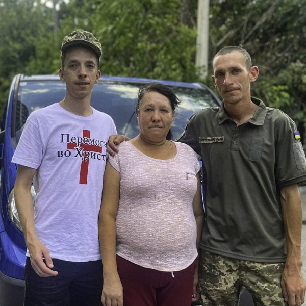 Sergey Shupishov, left, with his mother and his brother, Dima.