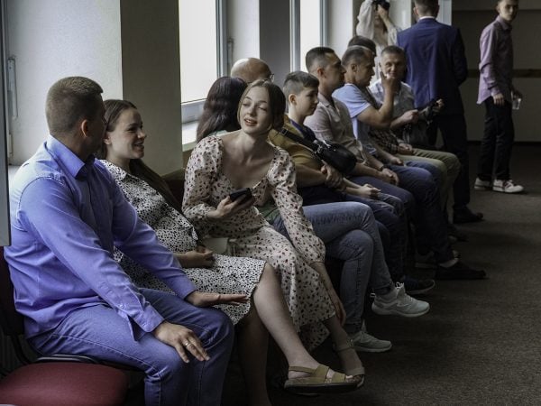 At a Christian retreat center in Iripin, classroom windows are the only source of light as the Ukrainian Bible Institute's graduation begins. Electricity returned a few minutes into the ceremony.