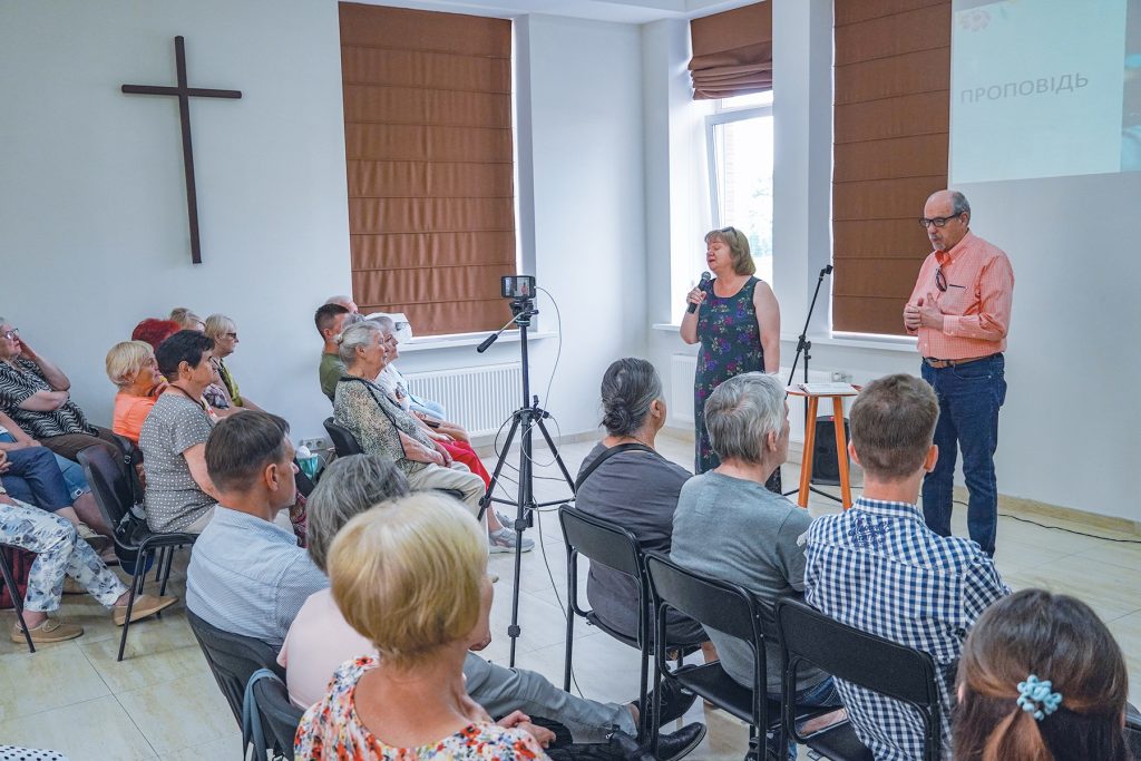 Richard Baggett preaches while Inna Kuzmenko translates during the Irpin Church of Christ’s Sunday worship.