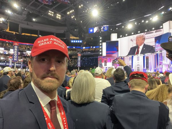 Ryan Walters sports a red "Make America Great Again" hat at the Republican National Convention in Milwaukee.