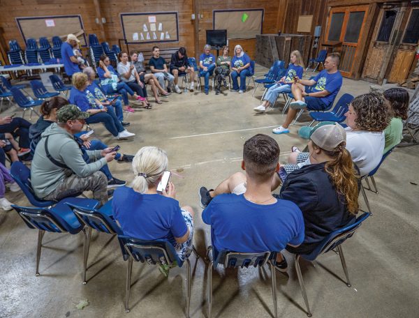 Ukrainian Christians circle their chairs for an evening of singing, study and prayer at the Greenbrier Ukrainian retreat.