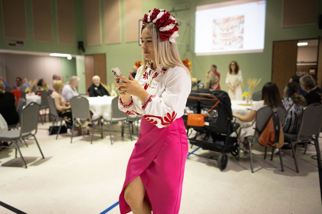 Olga Shostak wears traditional Ukrainian attire at the special Thanksgiving meal at the Memorial Church of Christ in Houston.