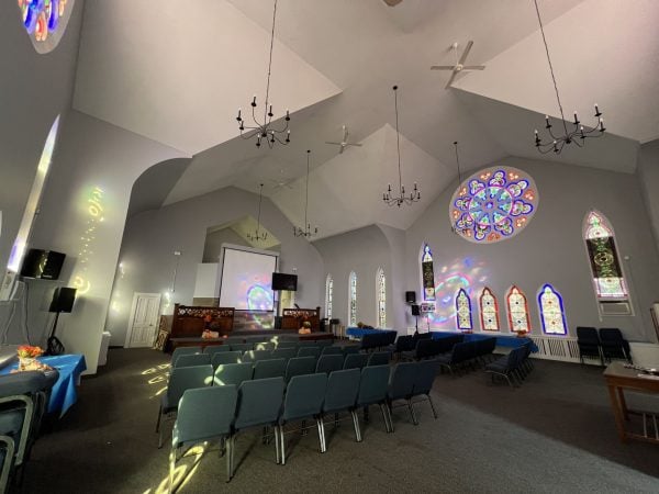 Rose windows splash colors on West Springfield’s sanctuary.