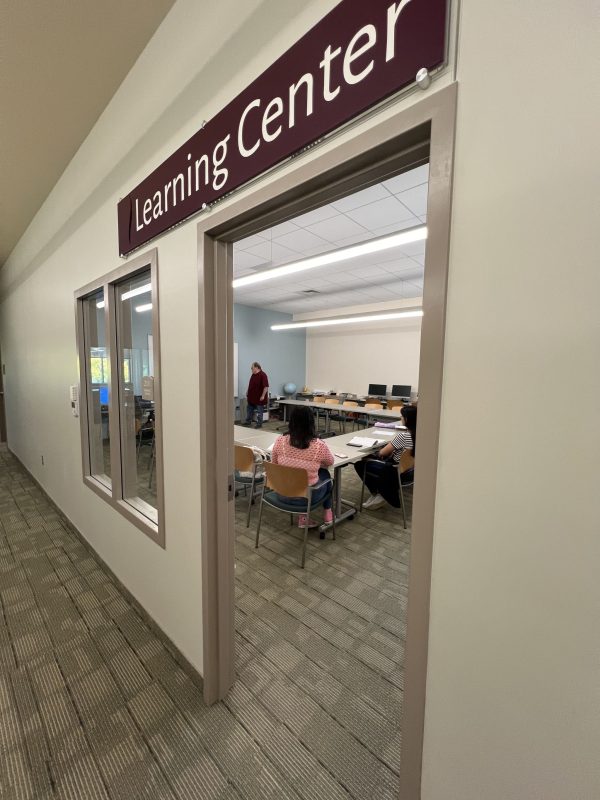 Gareth Flanary teaches students in the West Springfield church’s learning center.