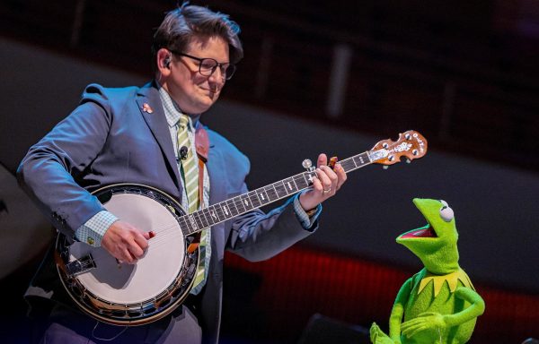 Comedian Lucas Ross shares the stage with his boss, Kermit the Frog, during a Henson Day celebration at the University of Maryland.