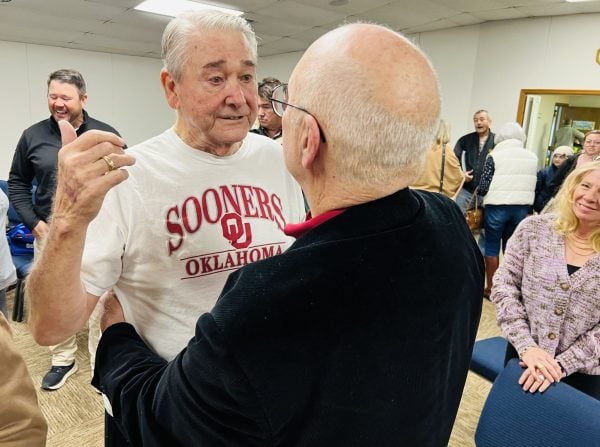 Carl McAdams, left, visits with preacher Floyd Kaiser after his baptism Sunday.