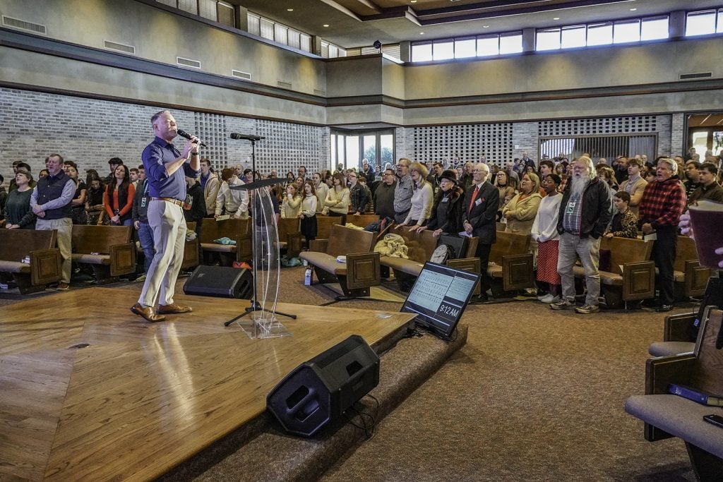 John Podein leads "Revive Us Again" during the CYC Dallas conference at the Waterview Church of Christ.