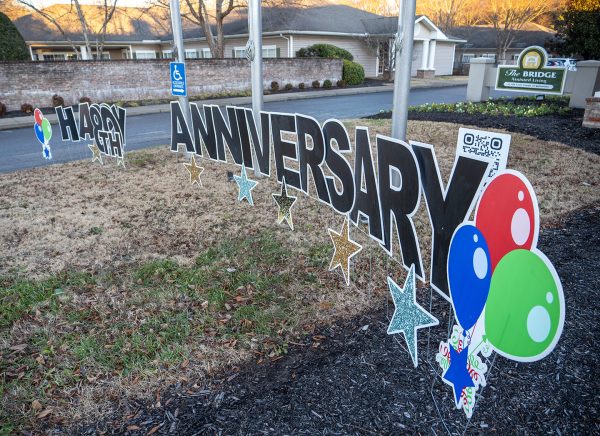 A sign outside an assisted-living facility in Columbia, Tenn., celebrates the Huckabys' 80th anniversary.