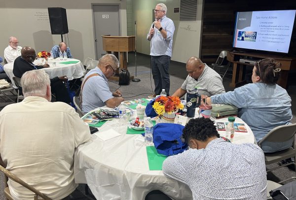 Blair Bryan, chairman of Heritage21, leads a prayer at a seminar on “The Challenge of the Empty Church” hosted by the Magnolia Center Church of Christ.