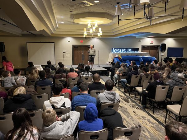 Dudley Chancey makes announcements at Winterfest Way Out West, an inaugural Christian youth event in Flagstaff, Ariz.