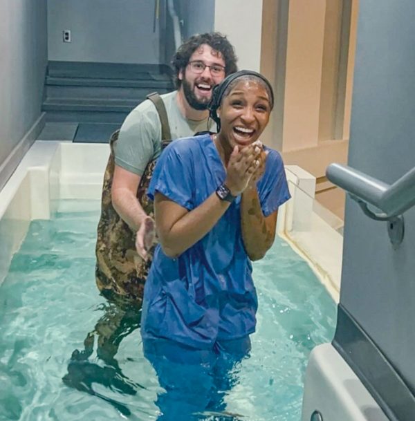 Allyse Rinae rejoices with college minister Nate Kidwell after Rinae’s baptism in Dalraida, Ala.