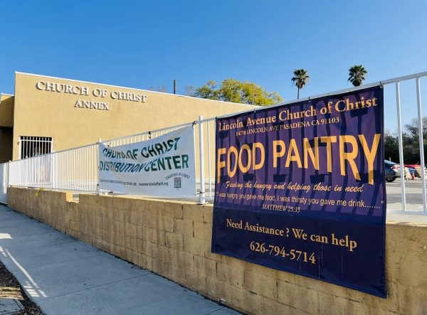 Signs alert neighbors to the Lincoln Avenue church's food pantry and its disaster relief distribution.