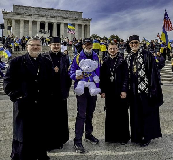 Jeff Abrams, center, stands with a group of Ukrainian Catholic clergy during a pro-Ukrainian rally in Washington. "I’m a bit underdressed," he joked.