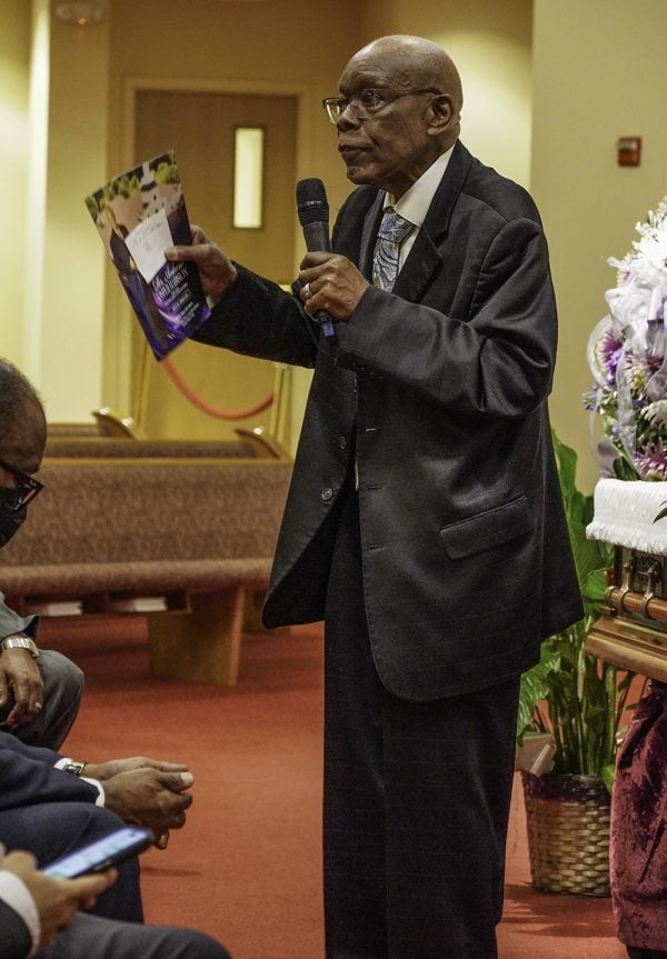 John Iverson talks about his friend Andrew J. Hairston during the Friday night memorial service.