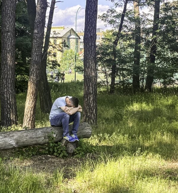 A Ukrainian minister prays during a retreat in the battle-damaged city of Irpin in 2024.