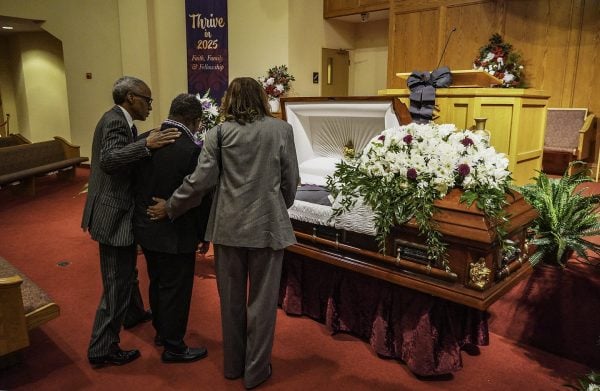 Mourners visit the casket of Andrew J. Hairston before the minister's "Homegoing Service."