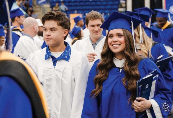 Graduates celebrate during commencement at Lubbock Christian University in Texas.