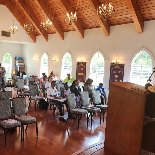 Members of the Fresno Church of Christ, formerly Agape Church of Christ, worship under their new name. 