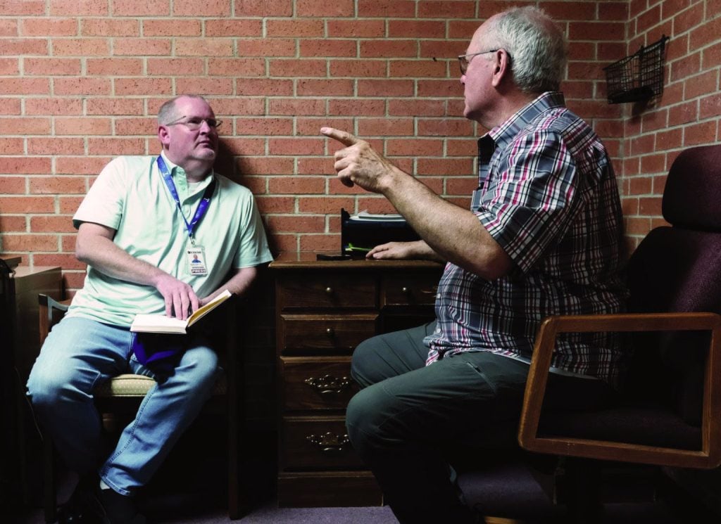 Bobby Ross Jr. interviews minister Danny Stewart after a tornado struck the Oklahoma town of Sulphur last year.