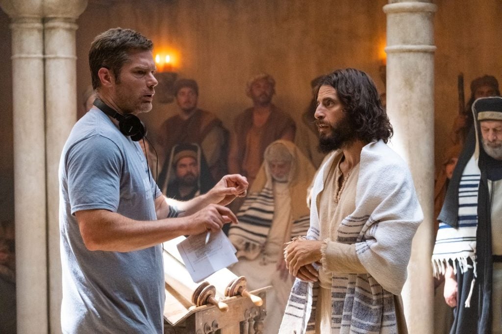 Dallas Jenkins talks to Jonathan Roumie, who stars as Jesus, on the set of “The Chosen.”