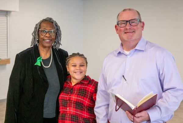 Bobby Ross Jr., right, visits with Gwen Cummings and her 8-year-old granddaughter, Makenna, at the new exhibit’s opening.