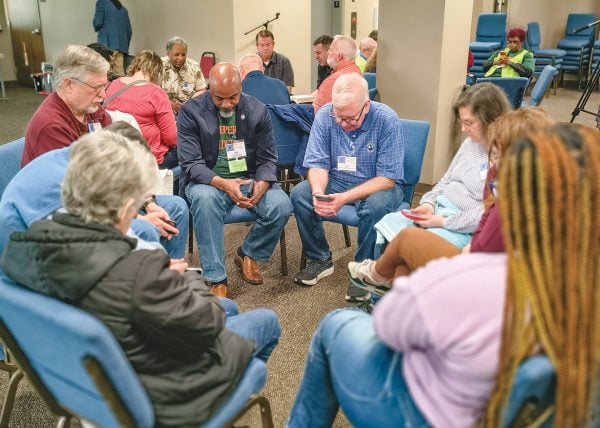 ‘Deeper and Wider’ inner city ministry 3 MyCelestialApp Participants pray during the National Urban Ministry Conference in North Little Rock, Ark.