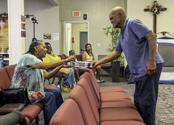 James Marsalis serves the Lord's Supper during the Hollygrove Church of Christ's Sunday worship service.