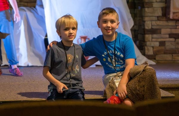 Across the Nation: A first century VBS, gold in the men’s triple jump and more quick takes 2 MyCelestialApp Hayes Holub (left) and Ryan Averill (right) smile before resuming worship on the stage.