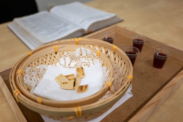 Communion in the new Vigo congregation, which meets in a rented commercial space in the city's heart.