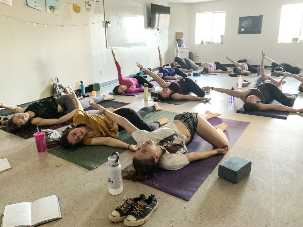 Women participate in a Christian yoga class led by Charity Morine.