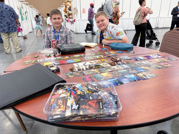 Jensen and Uriah Romo, members of the 70 West Church of Christ in Hot Springs, Ark. work on their collection of Discovery Bible Cards from Apologetics Press.