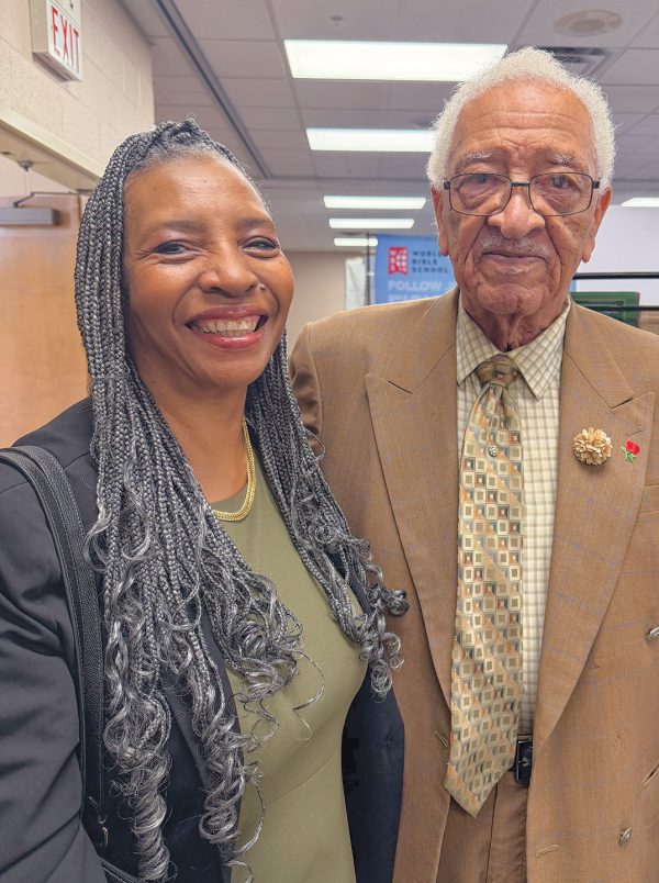 In the exhibitor hall at the Connect Conference, Alanna Griffin stands with her father, Bill Davis, a retired minister who recently turned 91.